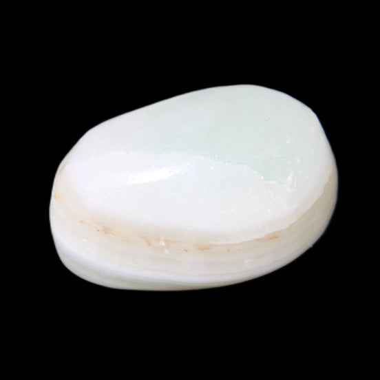 Pistachio Calcite tumbled stone 25-40mm 20-30g in sunlight - Rocks and Things Store