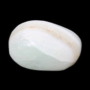 Pistachio Calcite tumbled stone 25-40mm 20-30g in sunlight - Rocks and Things Store