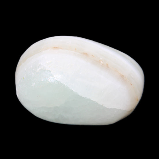 Pistachio Calcite tumbled stone 25-40mm 20-30g in sunlight - Rocks and Things Store