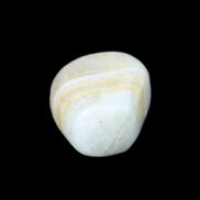 Pistachio Calcite tumbled stone 25-40mm 20-30g in sunlight - Rocks and Things Store