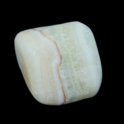 Pistachio Calcite tumbled stone 25-40mm 20-30g in sunlight - Rocks and Things Store