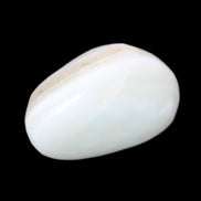 Pistachio Calcite tumbled stone 25-40mm 20-30g in sunlight - Rocks and Things Store