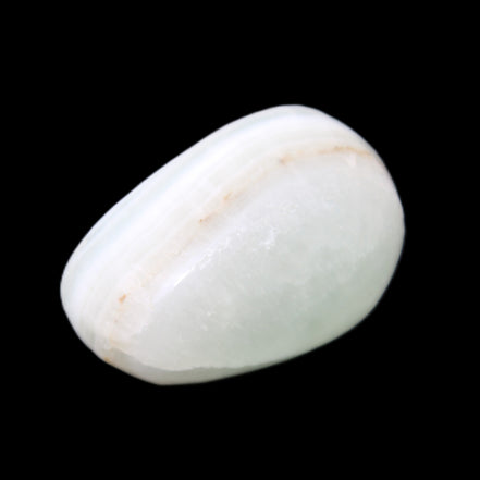 Pistachio Calcite tumbled stone 25-40mm 20-30g in sunlight - Rocks and Things Store