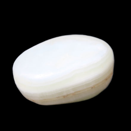 Pistachio Calcite tumbled stone 25-40mm 20-30g in sunlight - Rocks and Things Store