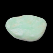 Pistachio Calcite tumbled stone 25-40mm 20-30g in sunlight - Rocks and Things Store