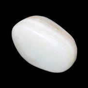 Pistachio Calcite tumbled stone 25-40mm 20-30g in sunlight - Rocks and Things Store