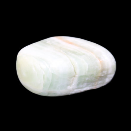 Pistachio Calcite tumbled stone 25-40mm 20-30g in sunlight - Rocks and Things Store