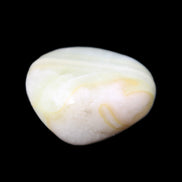 Pistachio Calcite tumbled stone 25-40mm 20-30g in sunlight - Rocks and Things Store