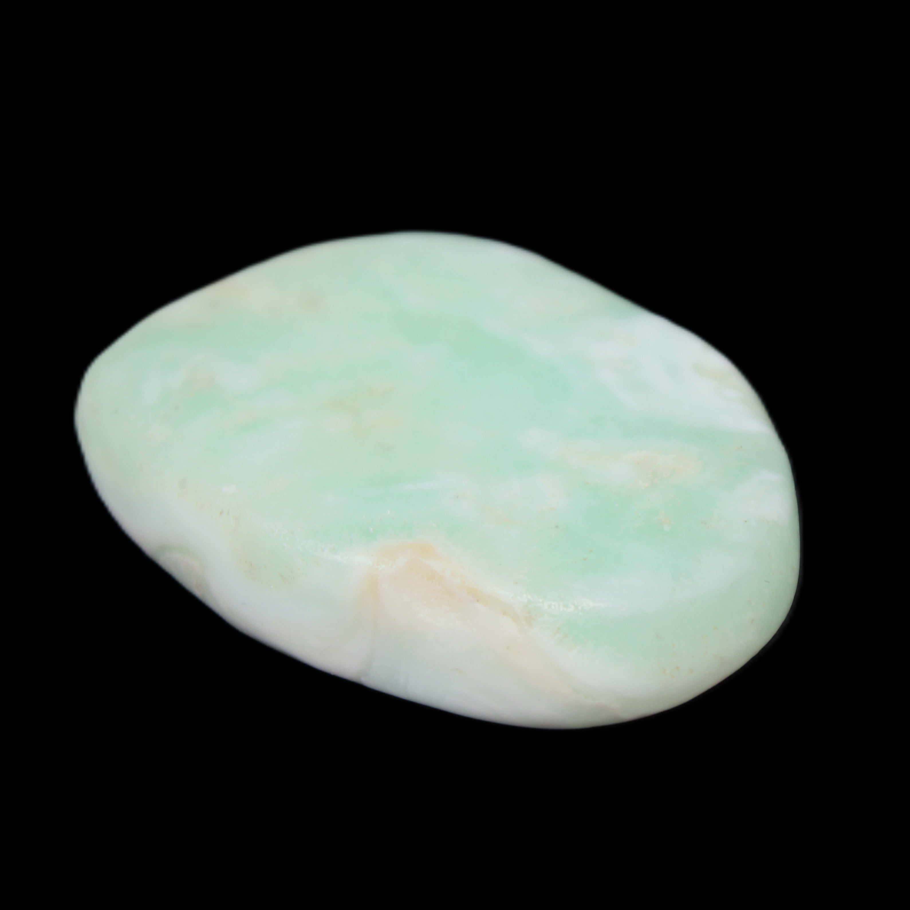 Pistachio Calcite tumbled stone 25-40mm 20-30g in sunlight - Rocks and Things Store