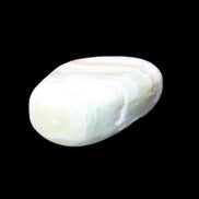 Pistachio Calcite tumbled stone 25-40mm 20-30g in sunlight - Rocks and Things Store