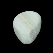 Pistachio Calcite tumbled stone 25-40mm 20-30g in sunlight - Rocks and Things Store