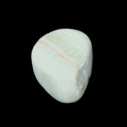 Pistachio Calcite tumbled stone 25-40mm 20-30g in sunlight - Rocks and Things Store