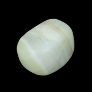 Pistachio Calcite tumbled stone 25-40mm 20-30g in sunlight - Rocks and Things Store