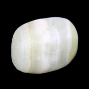 Pistachio Calcite tumbled stone 25-40mm 20-30g in sunlight - Rocks and Things Store