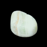 Pistachio Calcite tumbled stone 25-40mm 20-30g in sunlight - Rocks and Things Store