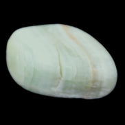 Pistachio Calcite tumbled stone 25-40mm 20-30g in sunlight - Rocks and Things Store