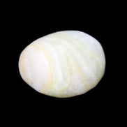 Pistachio Calcite tumbled stone 25-40mm 20-30g in sunlight - Rocks and Things Store