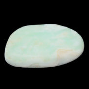 Pistachio Calcite tumbled stone 25-40mm 20-30g in sunlight - Rocks and Things Store