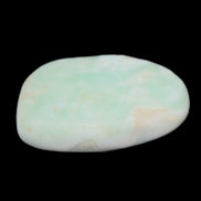 Pistachio Calcite tumbled stone 25-40mm 20-30g in sunlight - Rocks and Things Store