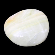 Pistachio Calcite tumbled stone 25-40mm 20-30g in sunlight - Rocks and Things Store
