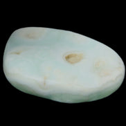 Pistachio Calcite tumbled stone 25-40mm 20-30g in sunlight - Rocks and Things Store