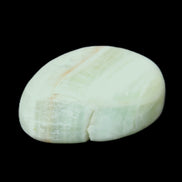 Pistachio Calcite tumbled stone 25-40mm 20-30g in sunlight - Rocks and Things Store