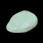 Pistachio Calcite tumbled stone 25-40mm 20-30g in sunlight - Rocks and Things Store