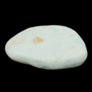 Pistachio Calcite tumbled stone 25-40mm 20-30g in sunlight - Rocks and Things Store