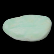 Pistachio Calcite tumbled stone 25-40mm 20-30g in sunlight - Rocks and Things Store