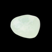 Pistachio Calcite tumbled stone 15-26mm 10-15g in sunlight - Rocks and Things Store