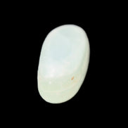Pistachio Calcite tumbled stone 15-26mm 10-15g in sunlight - Rocks and Things Store
