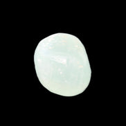 Pistachio Calcite tumbled stone 15-26mm 10-15g in sunlight - Rocks and Things Store