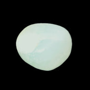 Pistachio Calcite tumbled stone 15-26mm 10-15g in sunlight - Rocks and Things Store