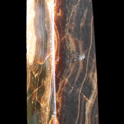 Chocolate Calcite obelisk 120*33*32mm 332g in sunlight - Rocks and Things Store