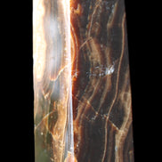 Chocolate Calcite obelisk 120*33*32mm 332g in sunlight - Rocks and Things Store