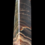 Chocolate Calcite obelisk 128*35*32mm 301g in sunlight - Rocks and Things Store