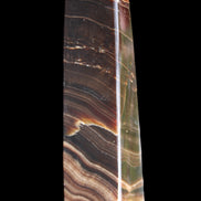 Chocolate Calcite obelisk 128*35*32mm 301g in sunlight - Rocks and Things Store