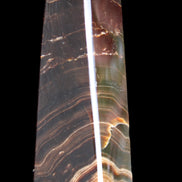 Chocolate Calcite obelisk 128*35*32mm 301g in sunlight - Rocks and Things Store