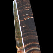 Chocolate Calcite obelisk 128*35*32mm 301g in sunlight - Rocks and Things Store