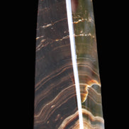 Chocolate Calcite obelisk 128*35*32mm 301g in sunlight - Rocks and Things Store