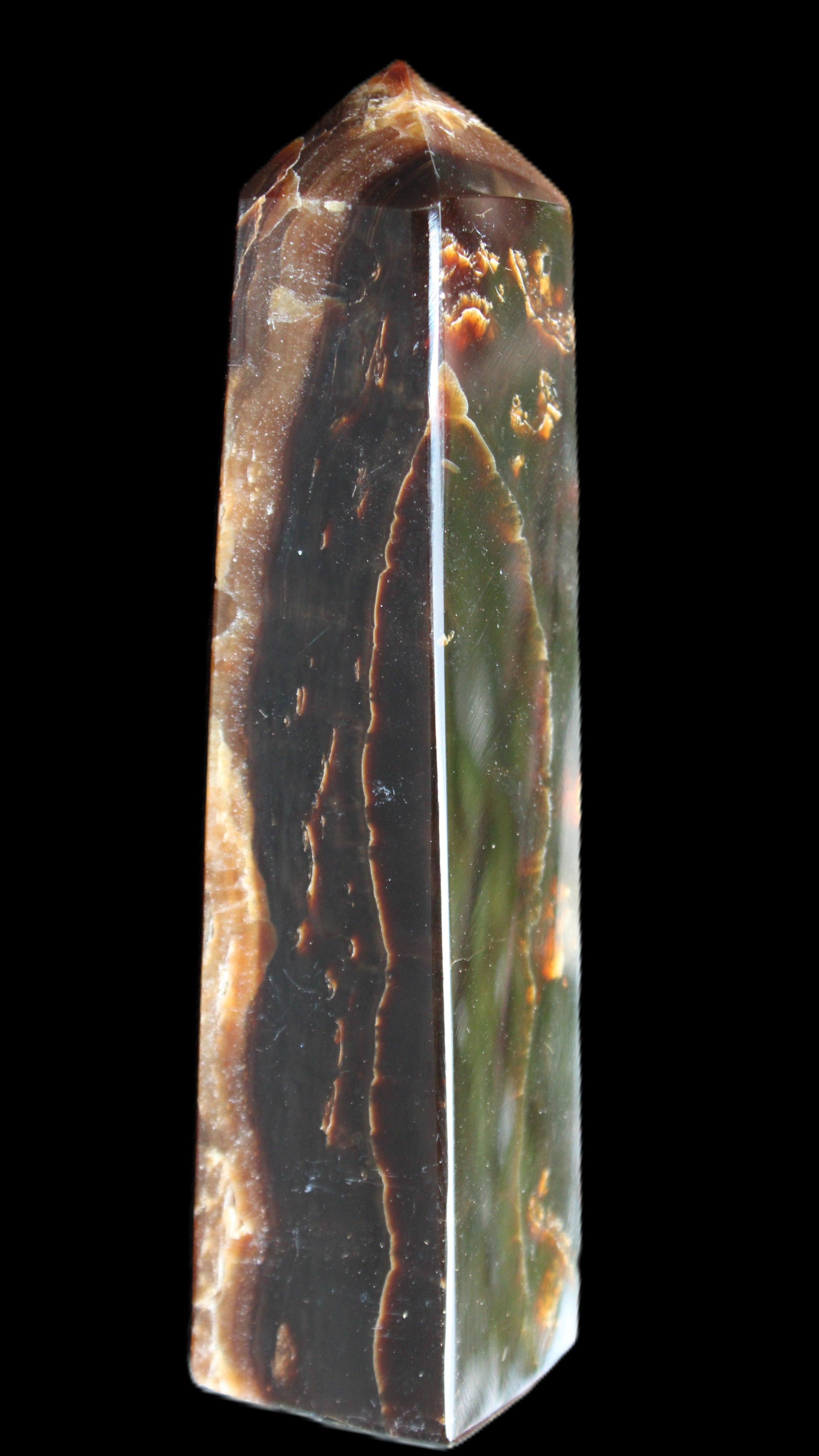 Chocolate Calcite obelisk 132*30*28mm 282g in sunlight - Rocks and Things Store