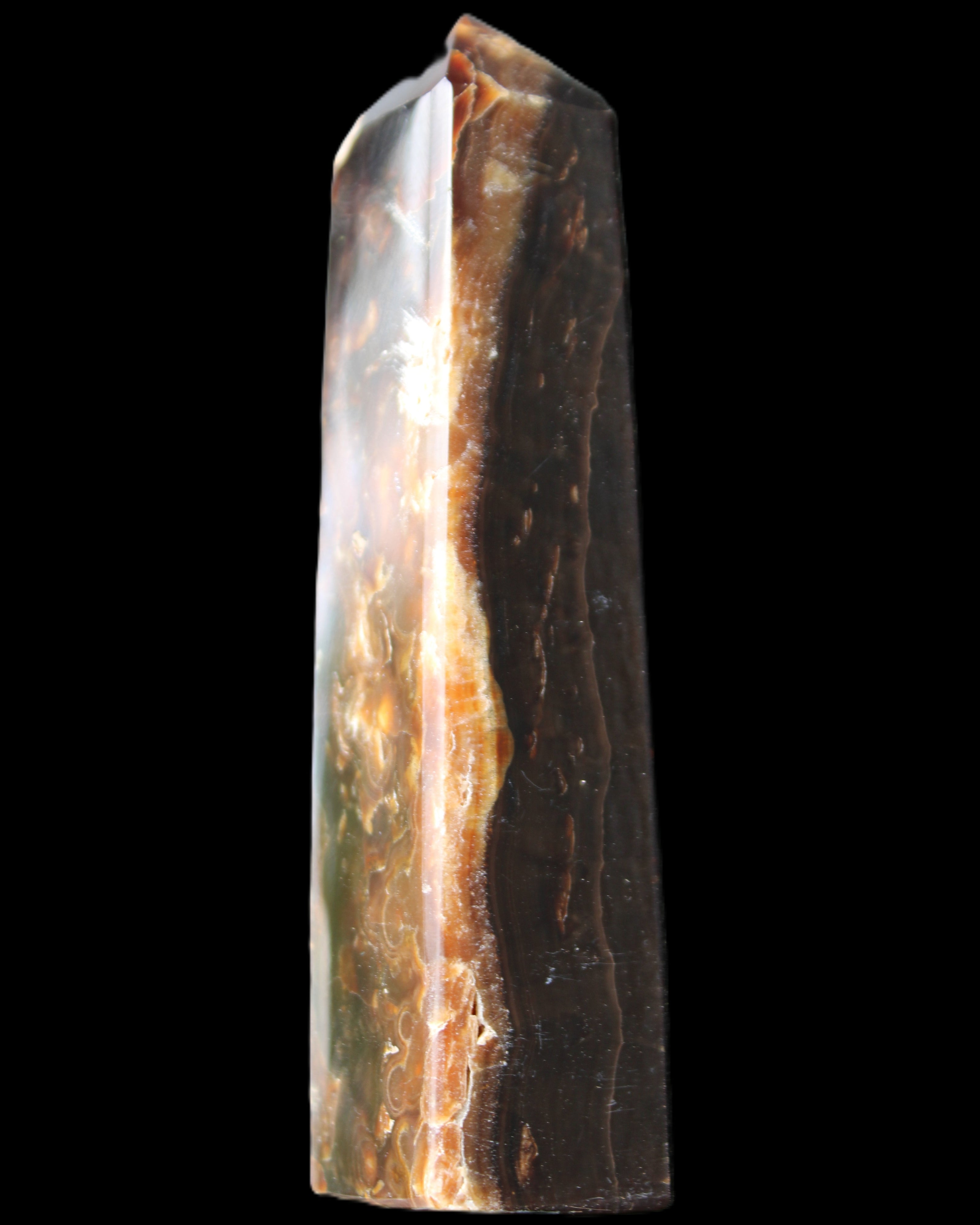 Chocolate Calcite obelisk 132*30*28mm 282g in sunlight - Rocks and Things Store