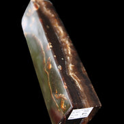 Chocolate Calcite obelisk 132*30*28mm 282g in sunlight - Rocks and Things Store