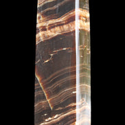 Chocolate Calcite obelisk 113*33*21mm 201g in sunlight - Rocks and Things Store