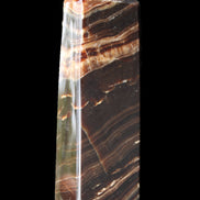 Chocolate Calcite obelisk 113*33*21mm 201g in sunlight - Rocks and Things Store