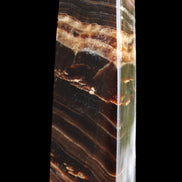Chocolate Calcite obelisk 113*33*21mm 201g in sunlight - Rocks and Things Store