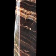Chocolate Calcite obelisk 113*33*21mm 201g in sunlight - Rocks and Things Store