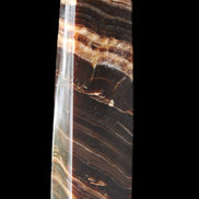 Chocolate Calcite obelisk 113*33*21mm 201g in sunlight - Rocks and Things Store