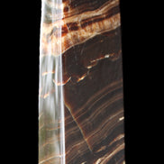 Chocolate Calcite obelisk 113*33*21mm 201g in sunlight - Rocks and Things Store