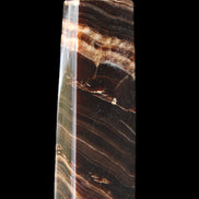 Chocolate Calcite obelisk 113*33*21mm 201g in sunlight - Rocks and Things Store